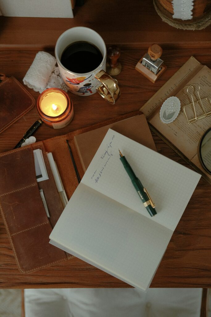 open notebook journal pen desk