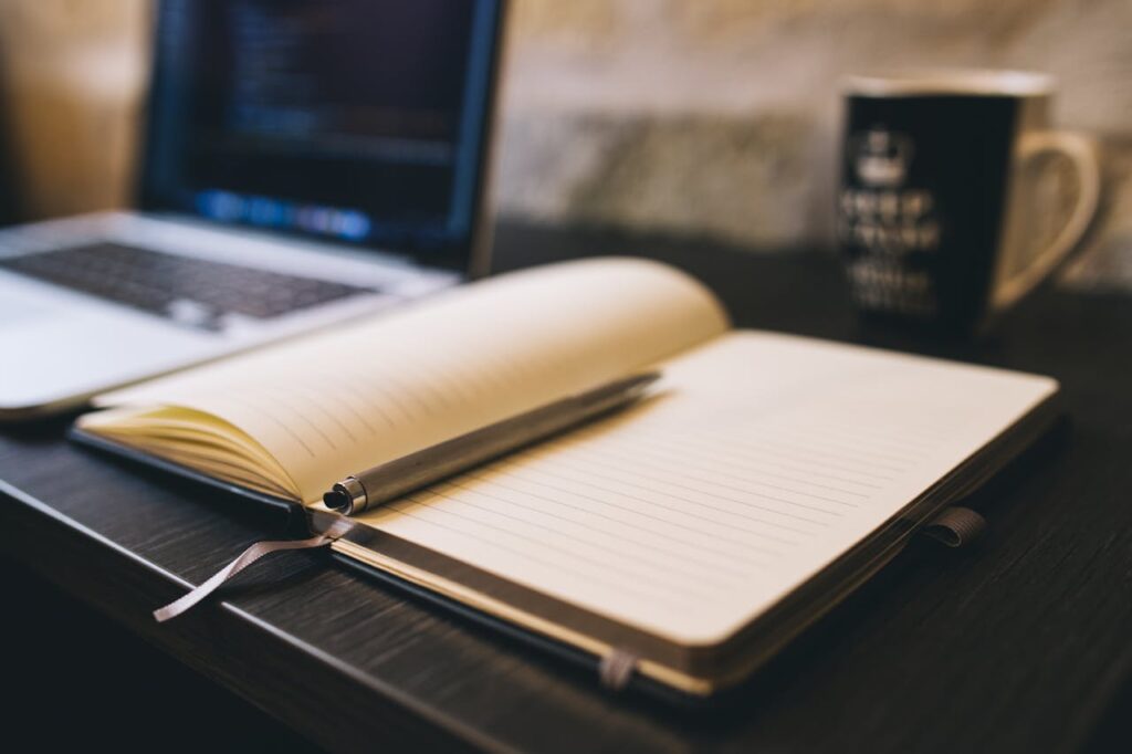 writing notebook pen desk
