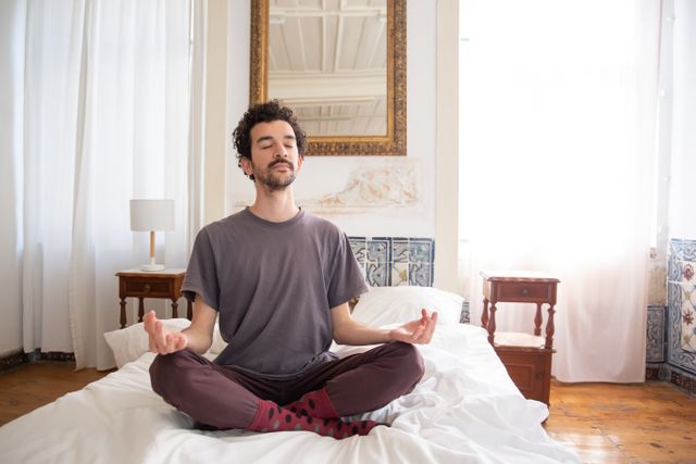 person practicing deep breathing bed night