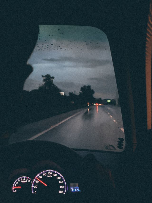 driver perspective highway traffic rain