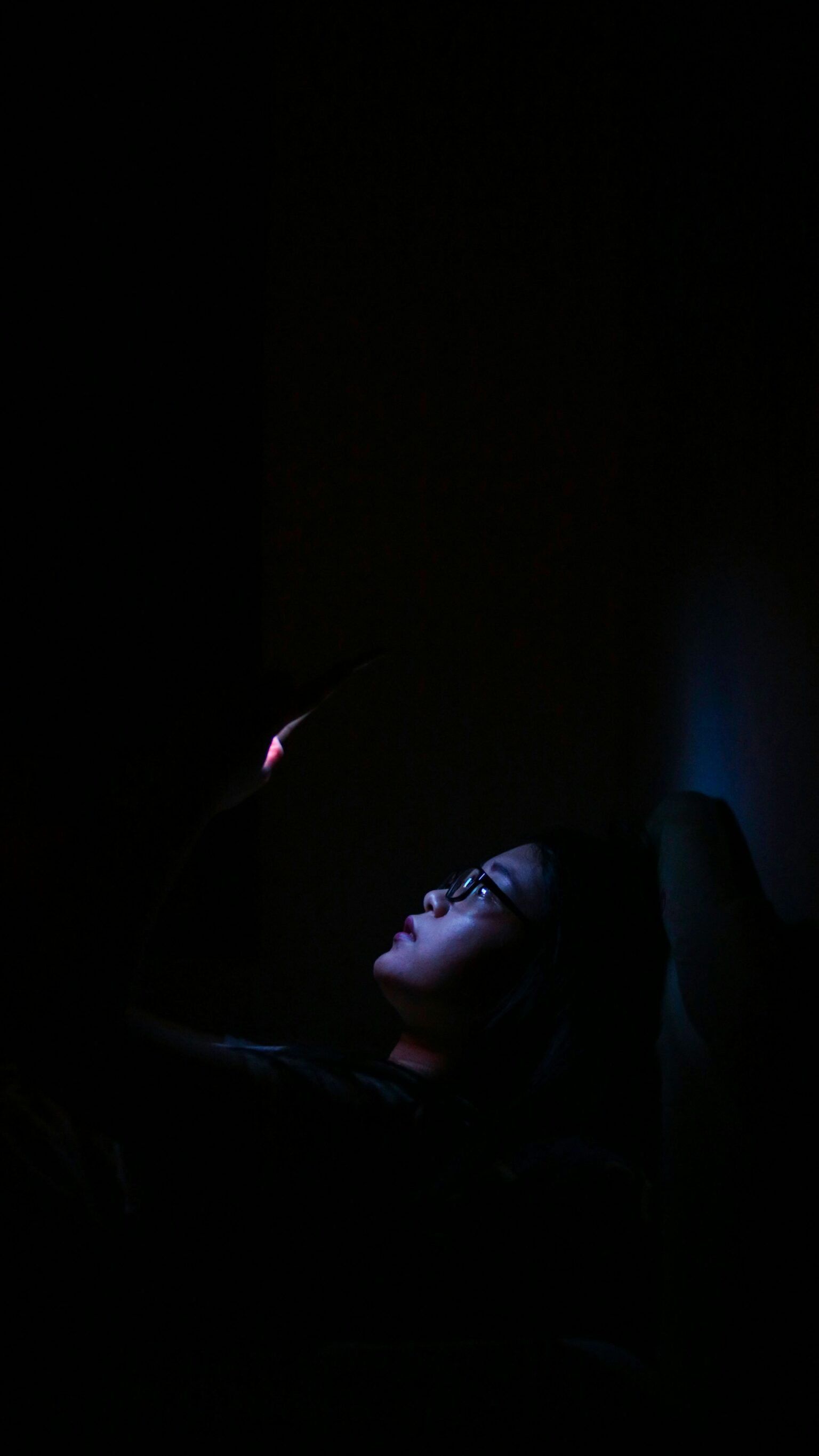 person anxious phone dark room